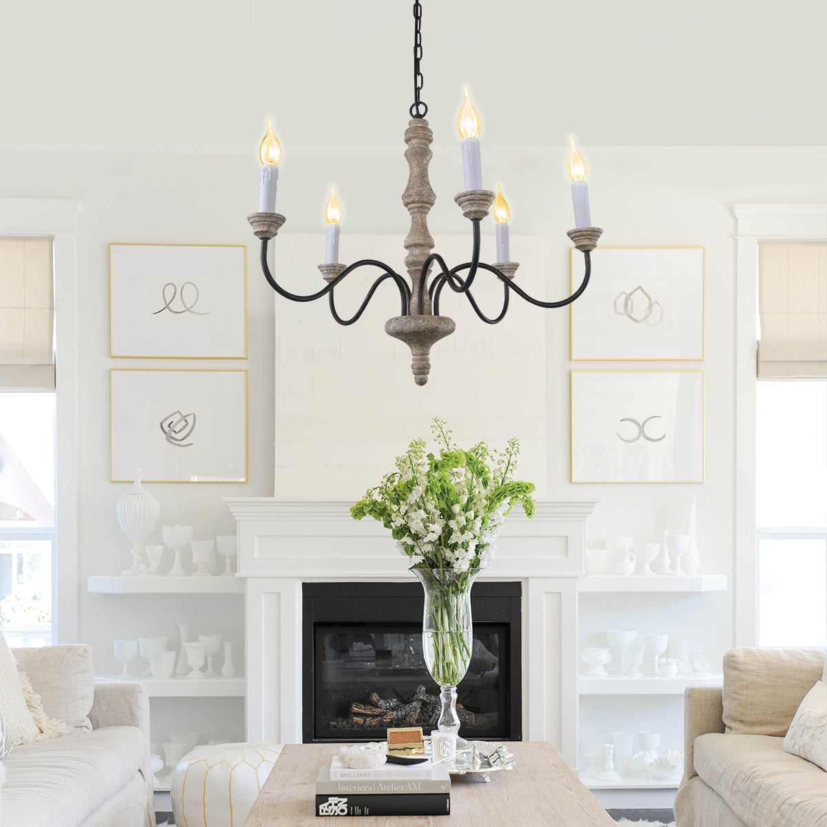 Amalia rustic candle chandelier above a living room fireplace