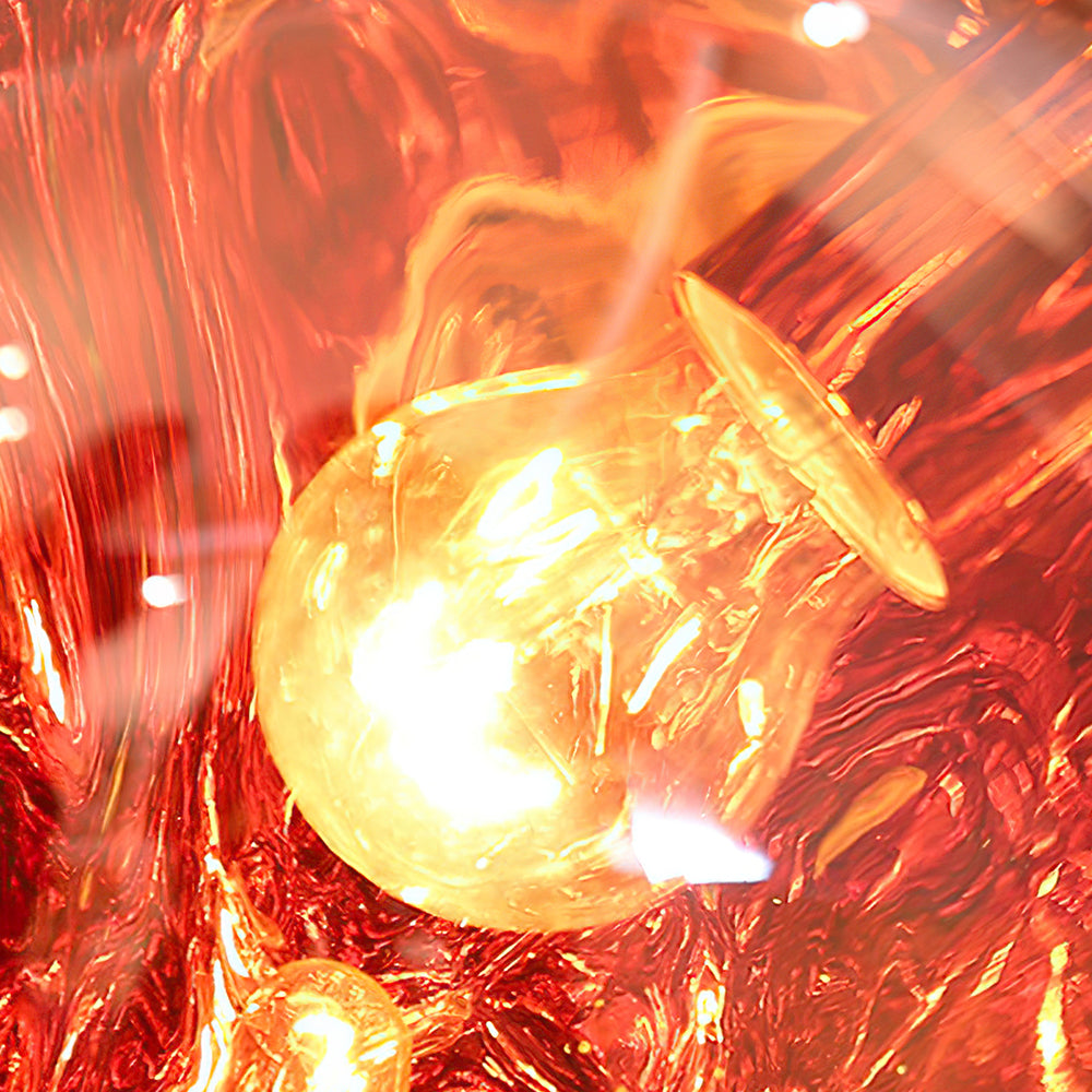 Maribel melt pendant – in amber, lit close-up
