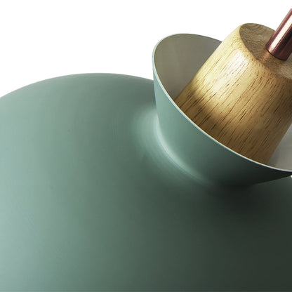 Close-up of the Solene pendant gold interior and wood neck