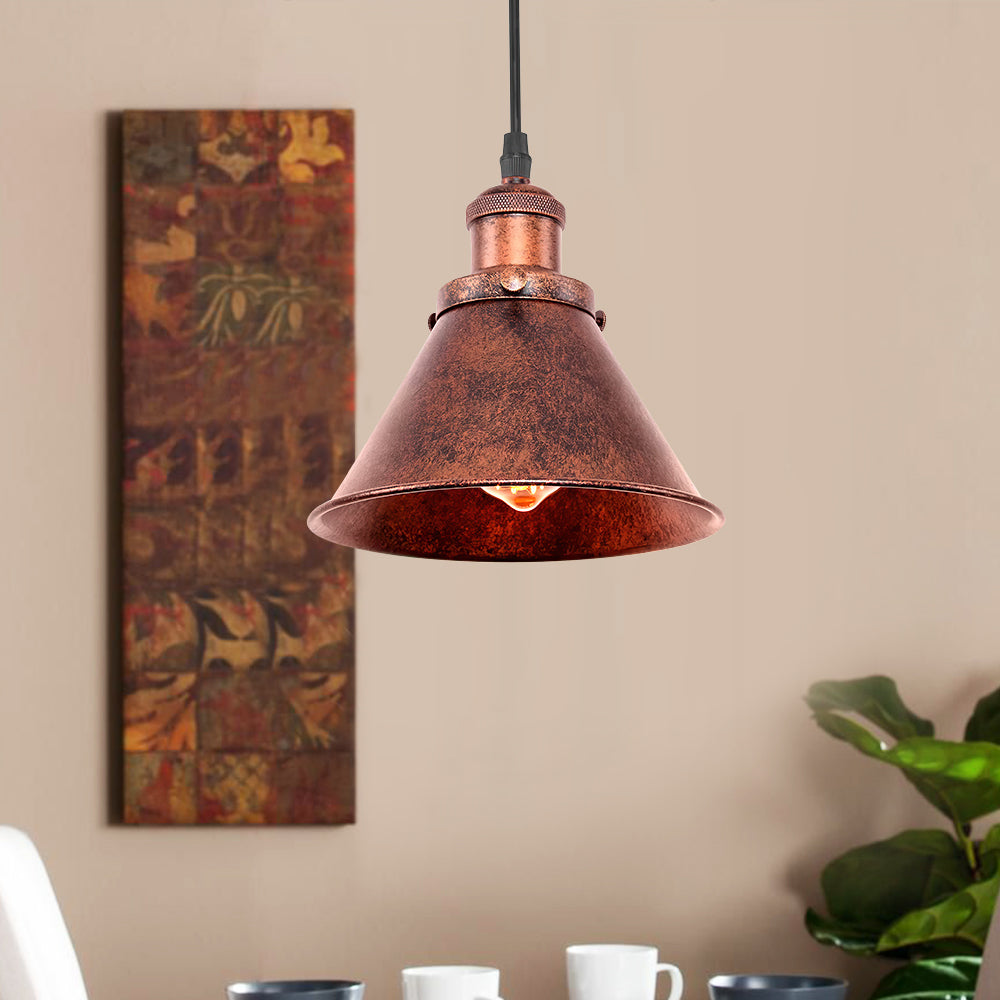 Carlotta copper cone pendant light – against a warm wall