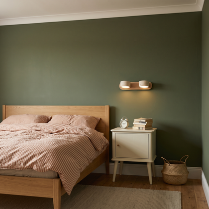 Livia 2-light travertine wall light beside a bed