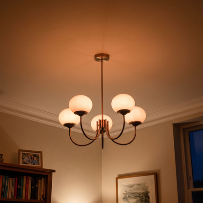 Margaux chandelier glowing warm at night