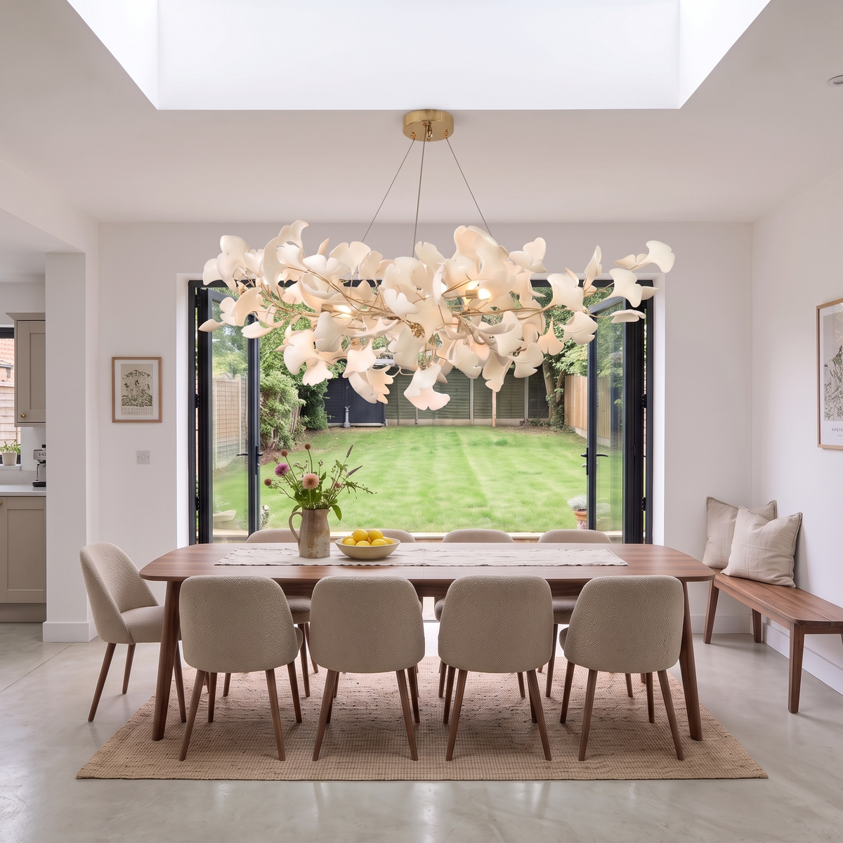 Gold Seraphina chandelier over a walnut dining table