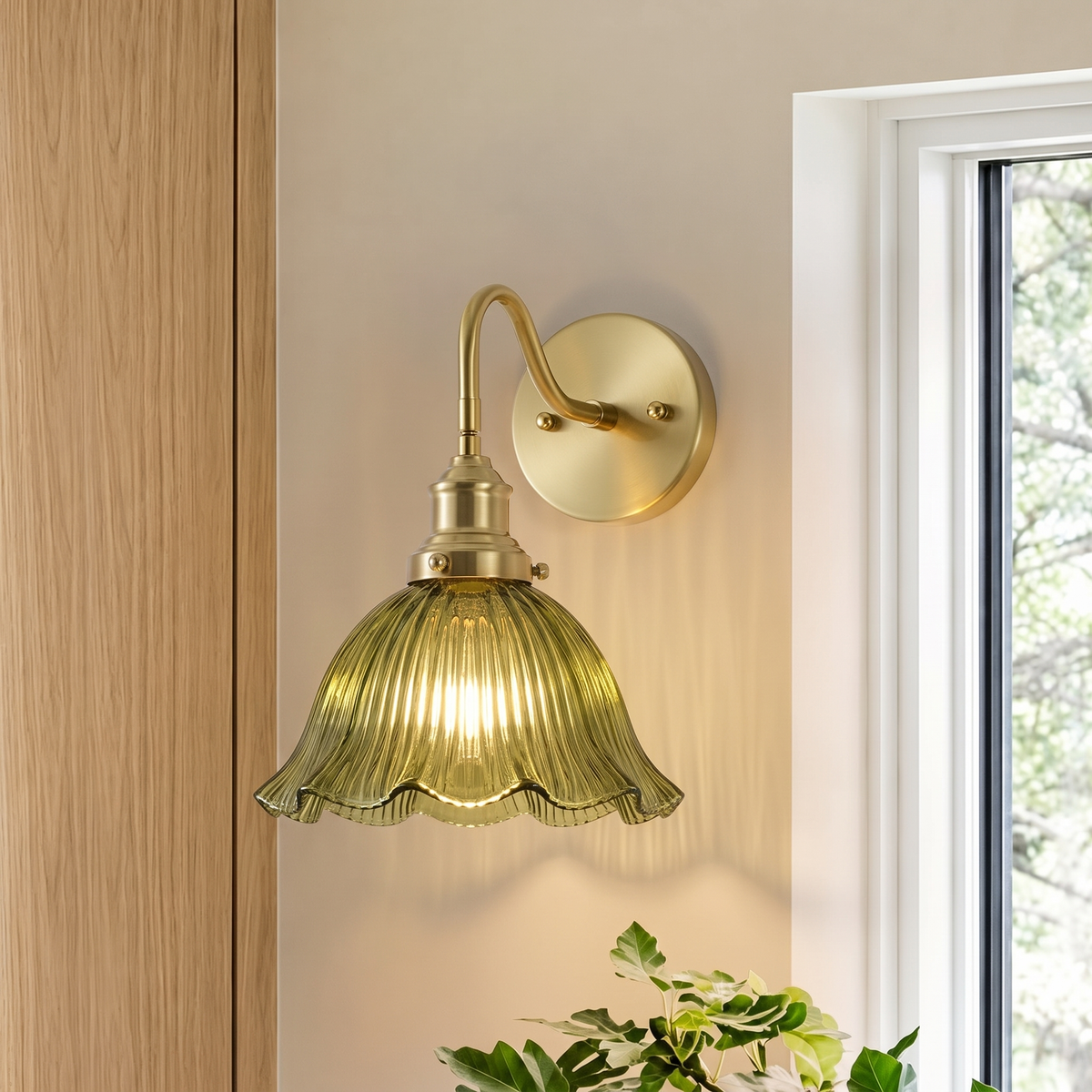 Fiorella flower wall light – style B in green ribbed glass by a window, lit