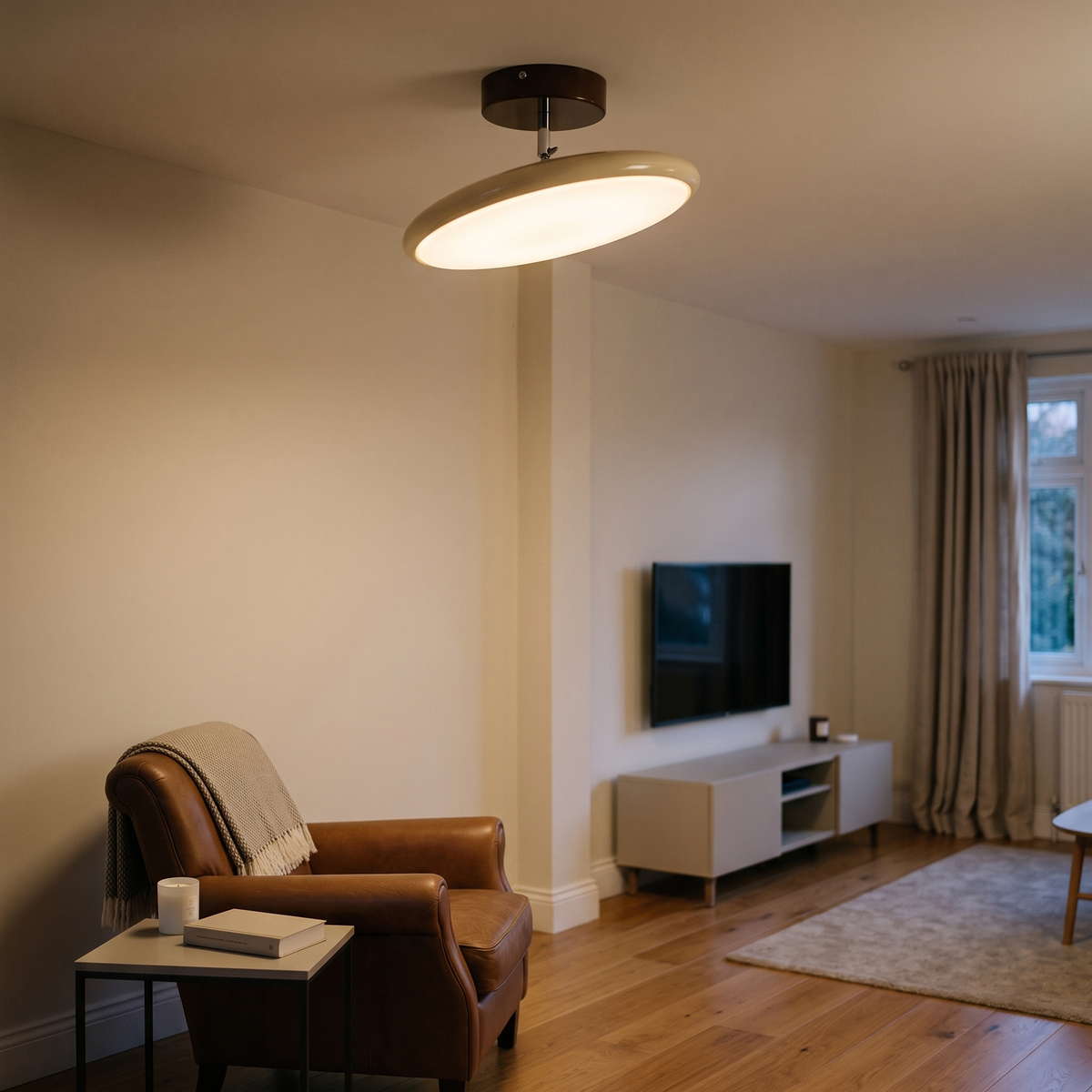 Matteo swivel ceiling lamp – glowing above a reading chair