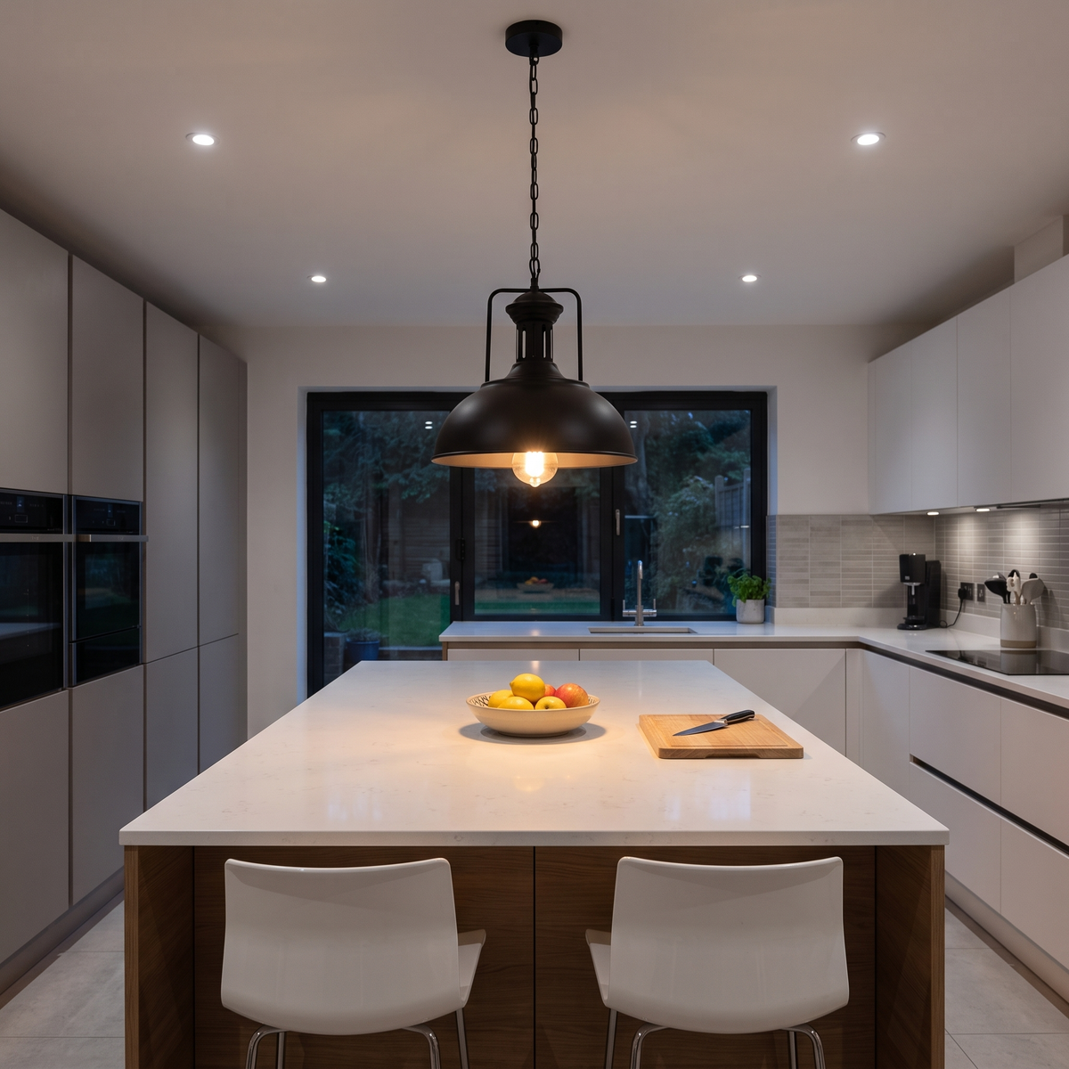 Leopold black dome pendant – glowing above a kitchen island