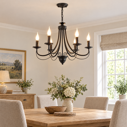Ramona black candle chandelier – glowing above a dining table