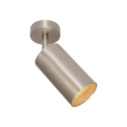 Remy adjustable spot ceiling light – in nickel, angled on white