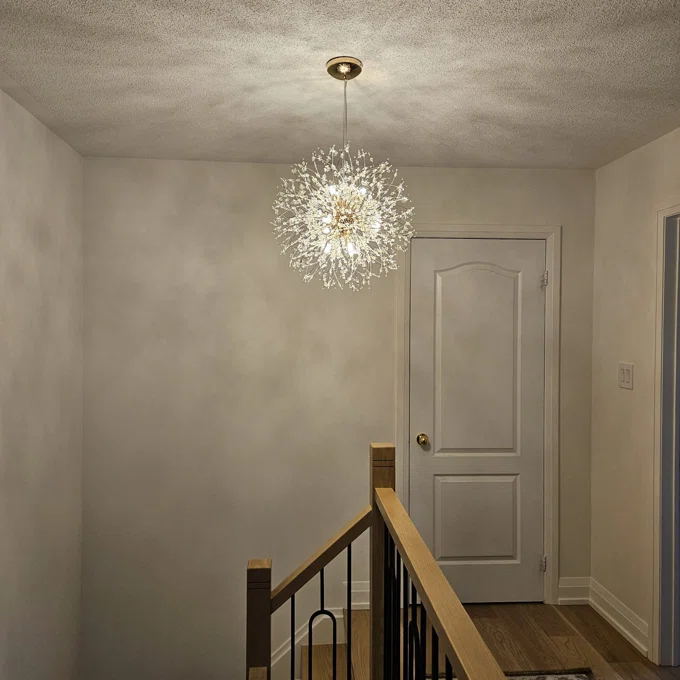 Delphine firework crystal chandelier – above a stairwell