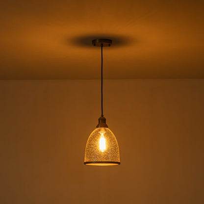 Sienna seeded glass dome pendant – lit in a dark room