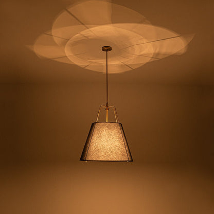 Ophelia tapered linen pendant – black shade lit with a warm glow