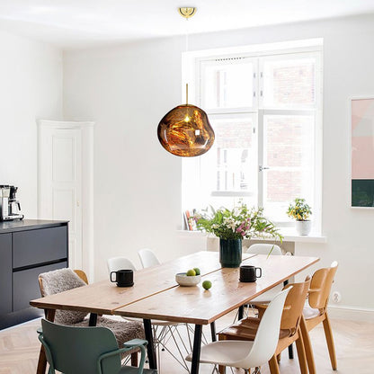 Maribel melt pendant – in amber in a dining room