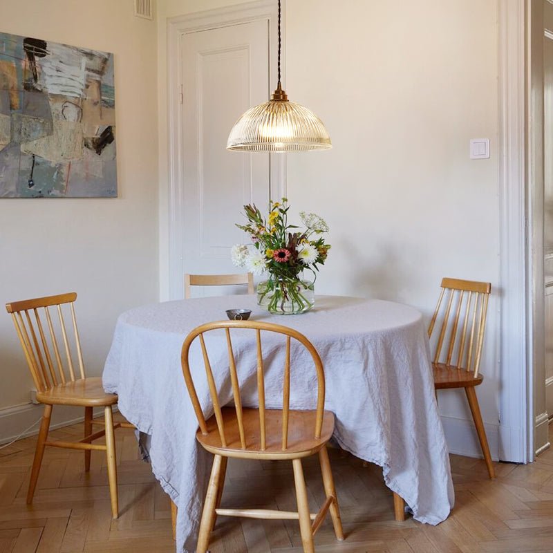 Eleonora ribbed glass pendant light – in clear glass over a round table