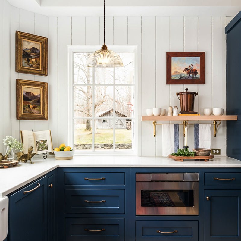 Eleonora ribbed glass pendant light – in a kitchen with blue cabinets
