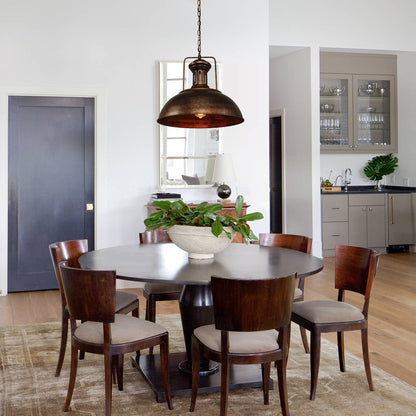 Leopold metal dome pendant light – in rustic finish over a round dining table