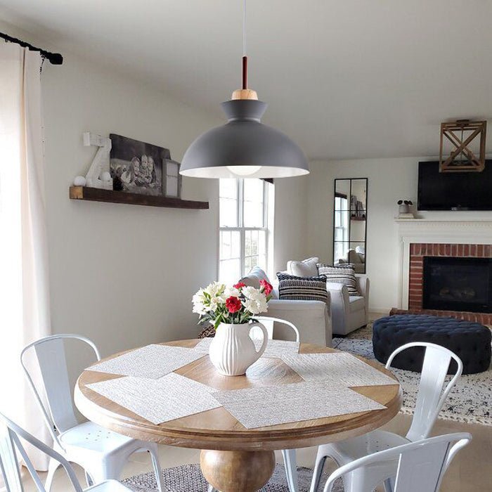 Solene grey dome pendant light above a round table in a living room