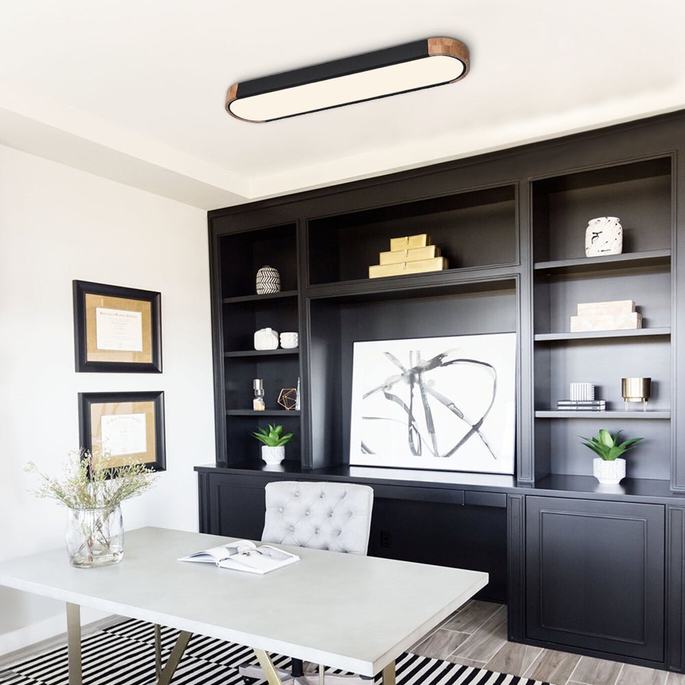 Imogen black oval LED ceiling light in a home office
