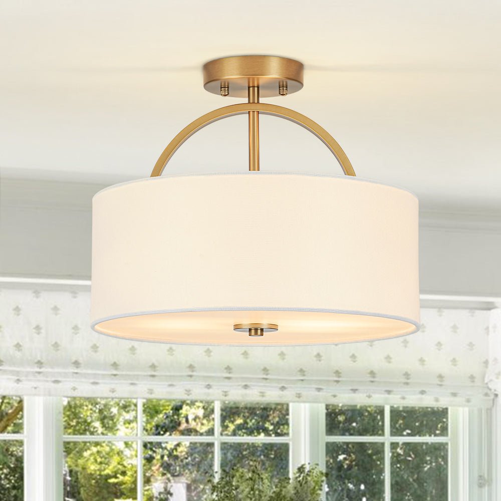 Isadora linen drum ceiling light – in brass by a window, close view