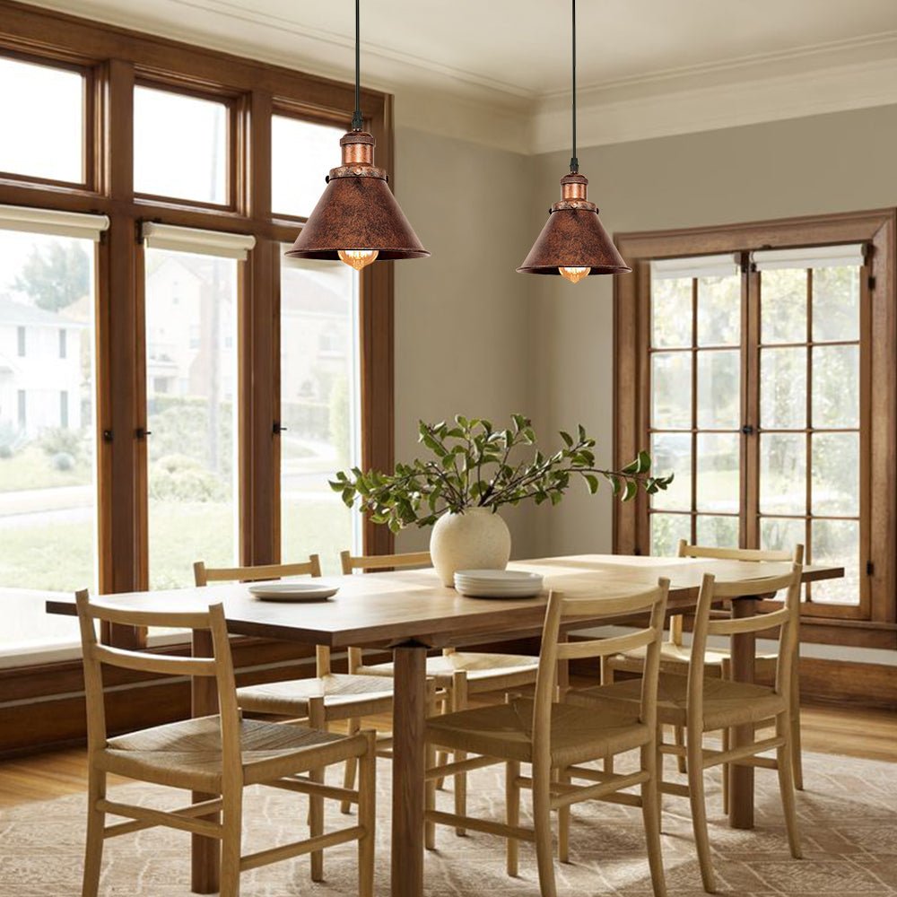 Carlotta copper cone pendant light – over a wooden dining table