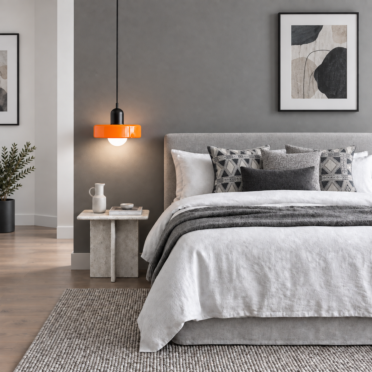 Verona pendant light hung beside a bed in a calm bedroom